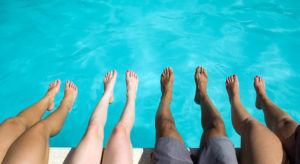 Horizon Foot & Ankle. St. Louis, MO - Four pairs of feet at the swimming pool.